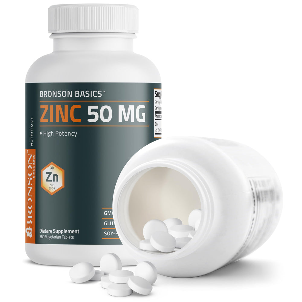 Tableta Bronson Zinc sostenida en mano para comparar tamaño y dosificación visual