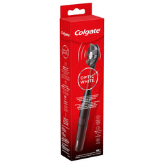 Colgate tamaño del cepillo comparado con una mano para escala real