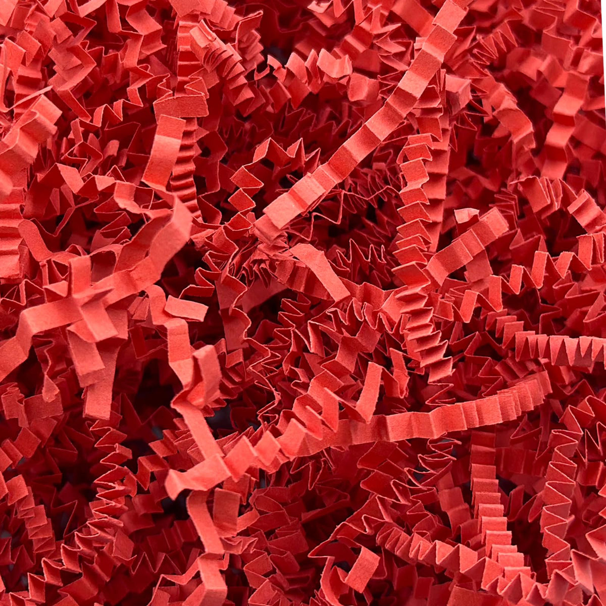 Corlcol paquete frontal de papel rizado rojo mostrando cantidad y color vibrante para presentación