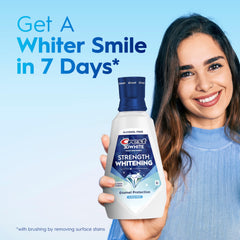 Crest 3D Clean Mint junto a una regla para mostrar tamaño real de 32 fl oz