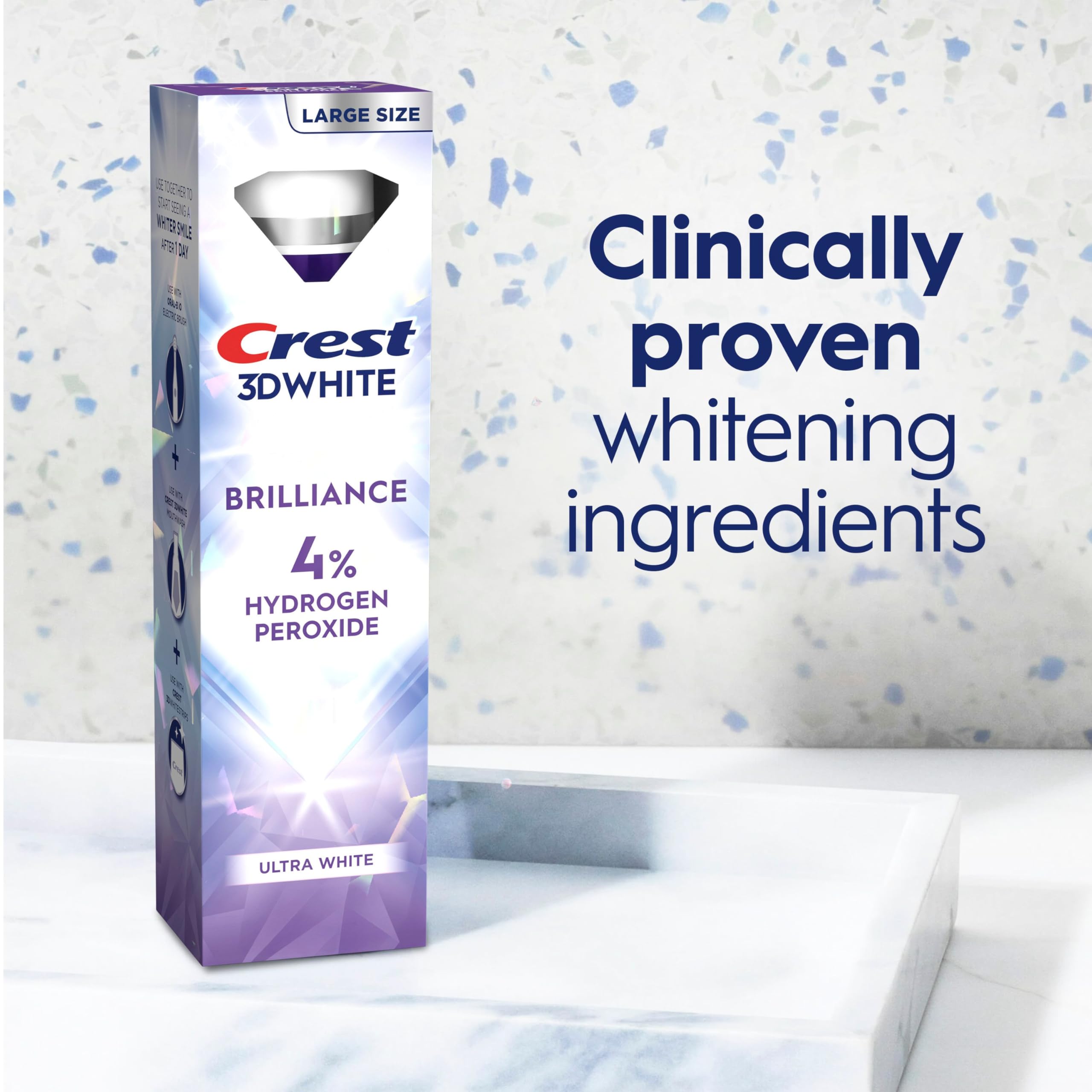 Crest tubo 3.8 oz junto a cepillo para referencia de tamaño