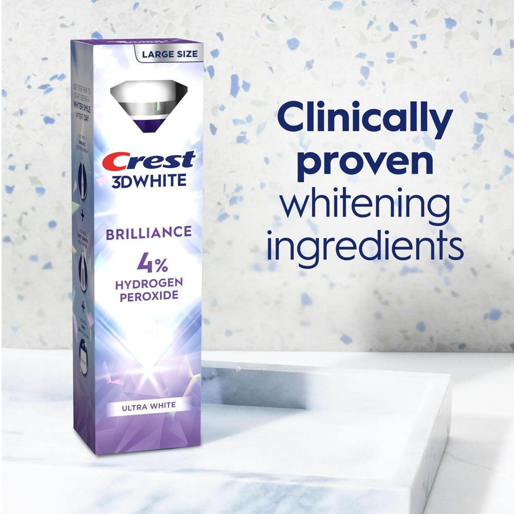 Crest tubo 3.8 oz junto a cepillo para referencia de tamaño