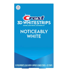 Crest paquete frontal mostrando tiras y beneficios de sonrisa más blanca