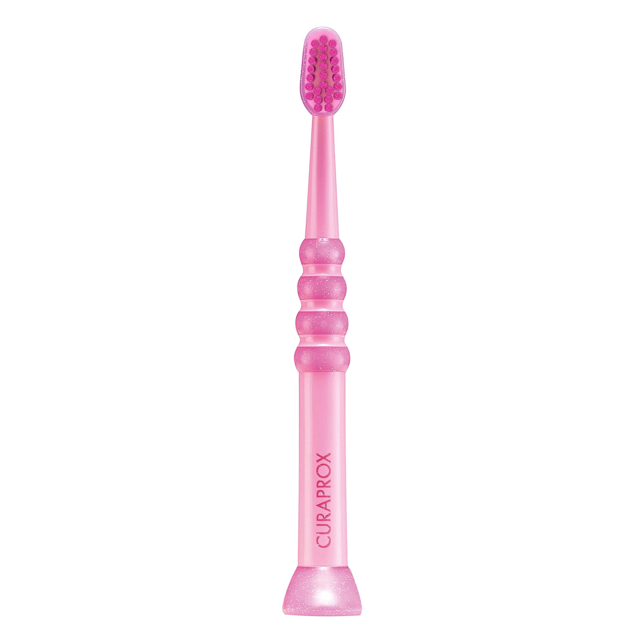Curaprox cepillo baby frente del empaque mostrando color rosa y diseño seguro