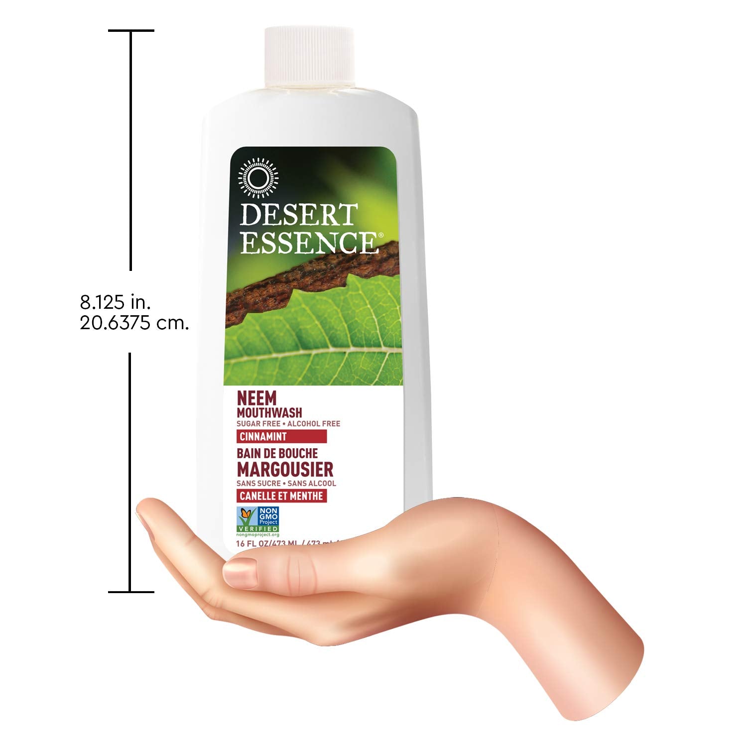 Desert Essence botella 16 oz junto a un cepillo para escala y uso familiar