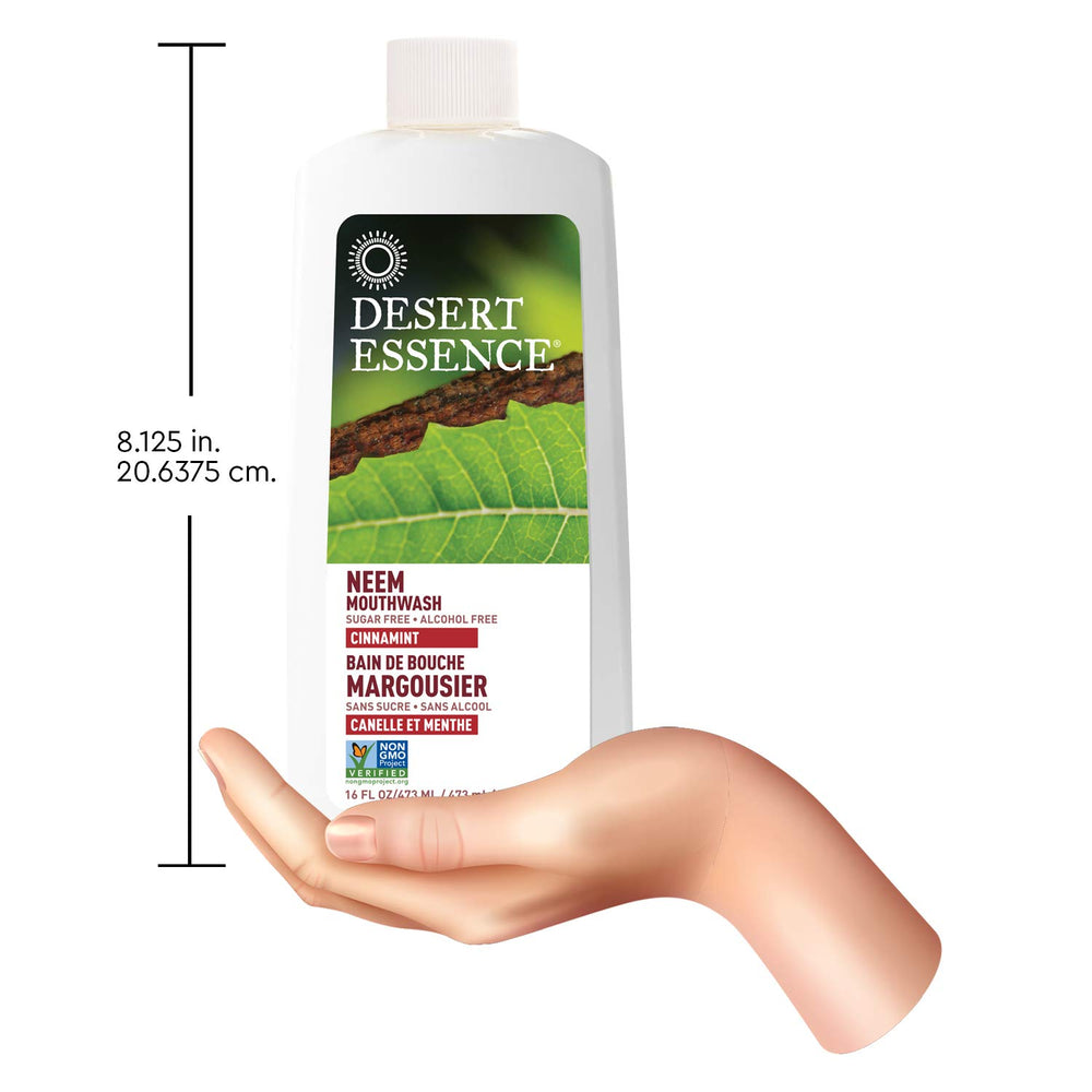 Desert Essence botella 16 oz junto a un cepillo para escala y uso familiar