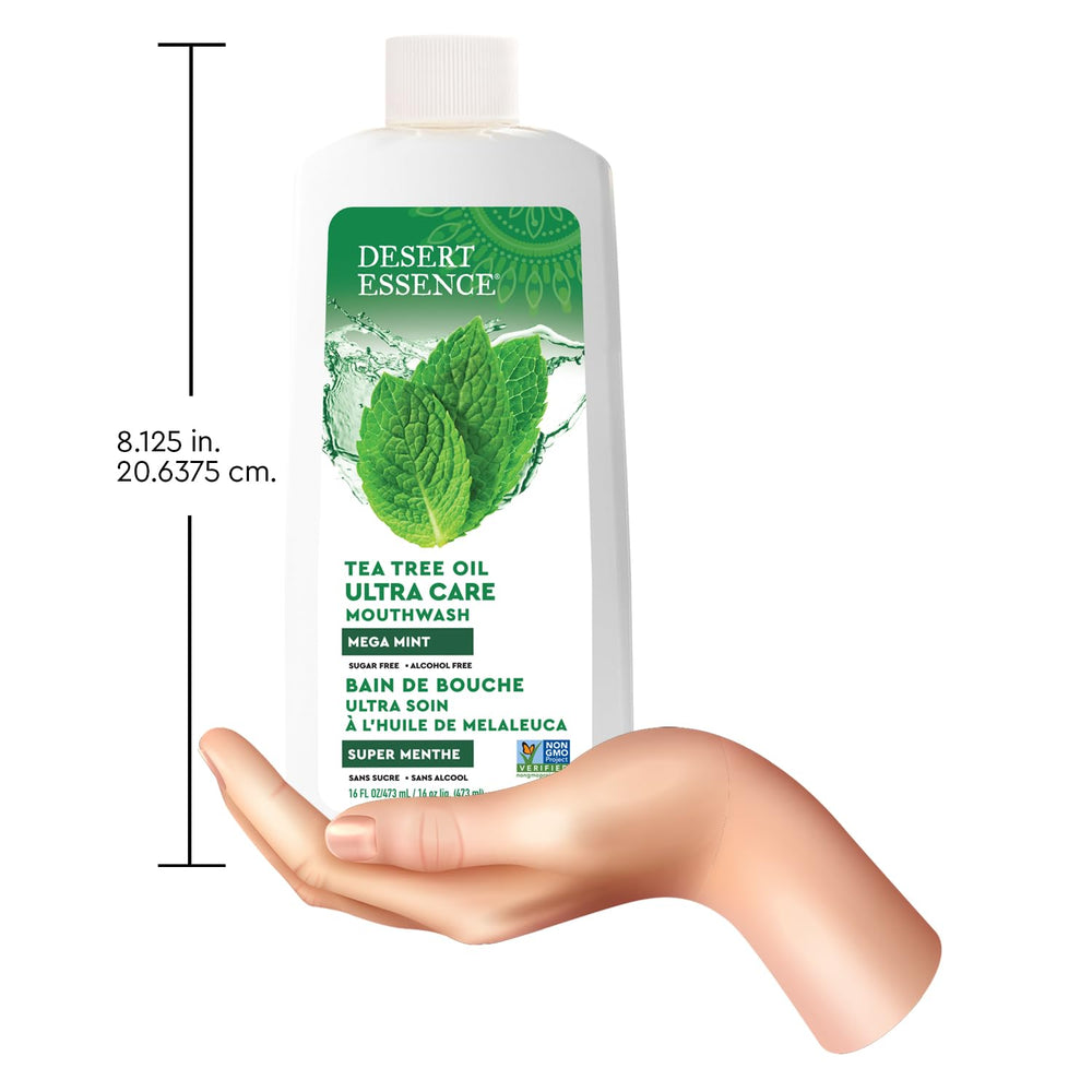 Desert Essence botella 473 ml junto a regla para comparar tamaño práctico