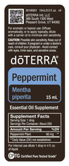 doTERRA Peppermint botella junto a baño para rutina aromática relajante