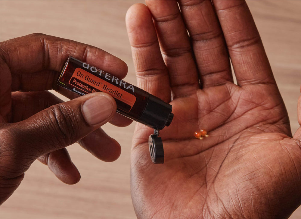 doTERRA detalle de textura de beadlets mostrando perlas vegetales y disolución