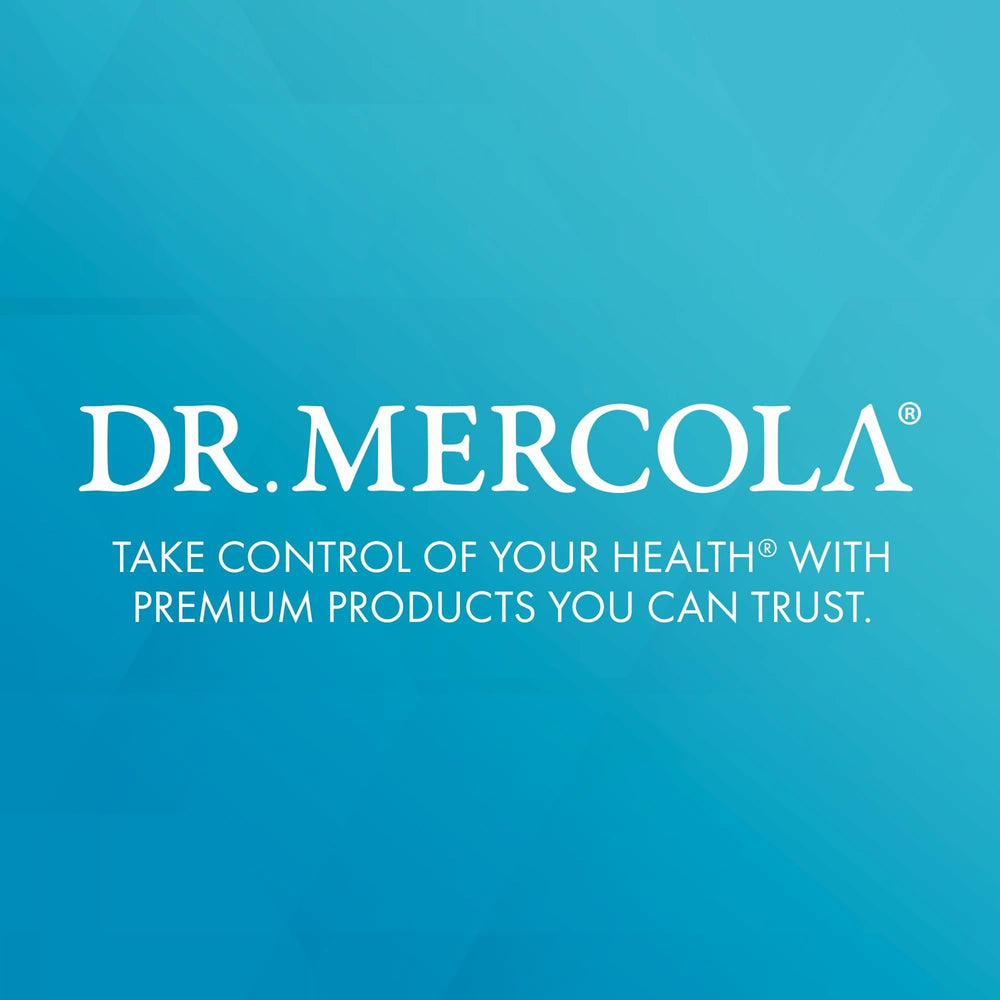 Dr. Mercola cápsula junto a moneda para comparar tamaño y dosificación
