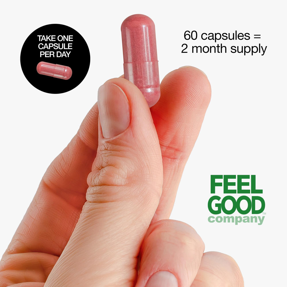FEEL GOOD cápsula junto a frutas para comparar tamaño y dosificación