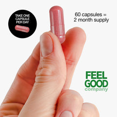 FEEL GOOD cápsula junto a frutas para comparar tamaño y dosificación