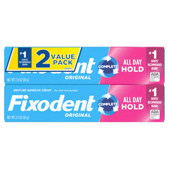 Fixodent tubo 2.4 oz junto a regla para referencia de tamaño