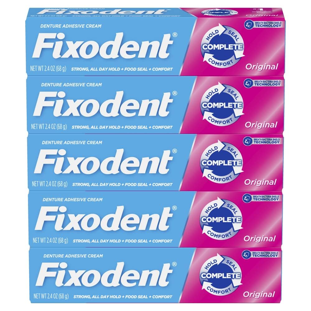 Fixodent tubo con tapón abierto mostrando textura de la crema