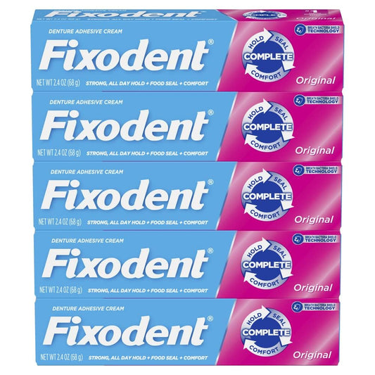 Fixodent tubo con tapón abierto mostrando textura de la crema