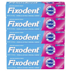 Fixodent tubo con tapón abierto mostrando textura de la crema