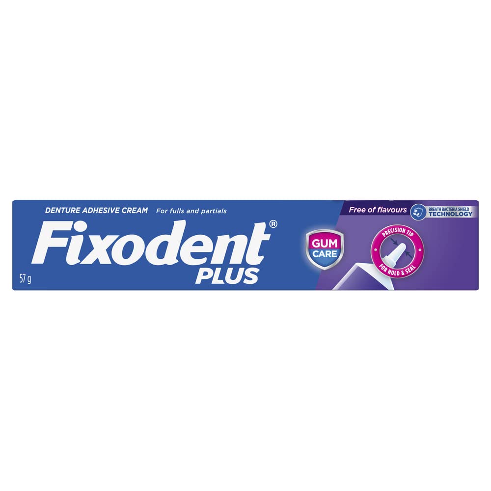Fixodent detalle de la textura cremosa saliendo del tubo, aplicación precisa