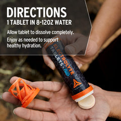 Fluid Tactical tamaño comparado con botella para escala, ideal para llevar