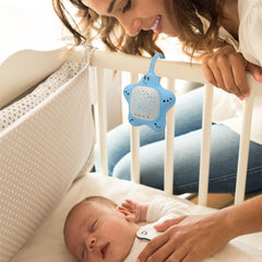Generic máquina sobre cuna con luz y sonido para ambiente estable de sueño