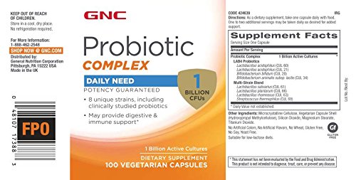 GNC cápsula abierta detalle de polvo probiótico y pureza