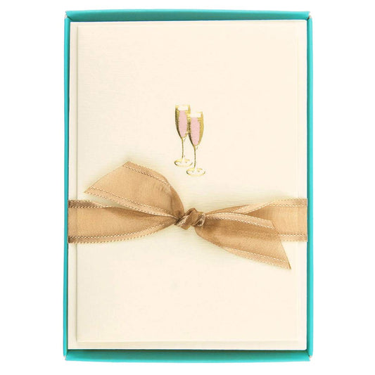 Graphique tarjeta frontal rosa con copas doradas, ofrece elegancia lista para regalar