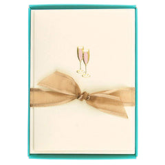 Graphique tarjeta frontal rosa con copas doradas, ofrece elegancia lista para regalar