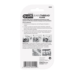 GUM EasyThread junto a una moneda para comparar tamaño, práctico y portátil