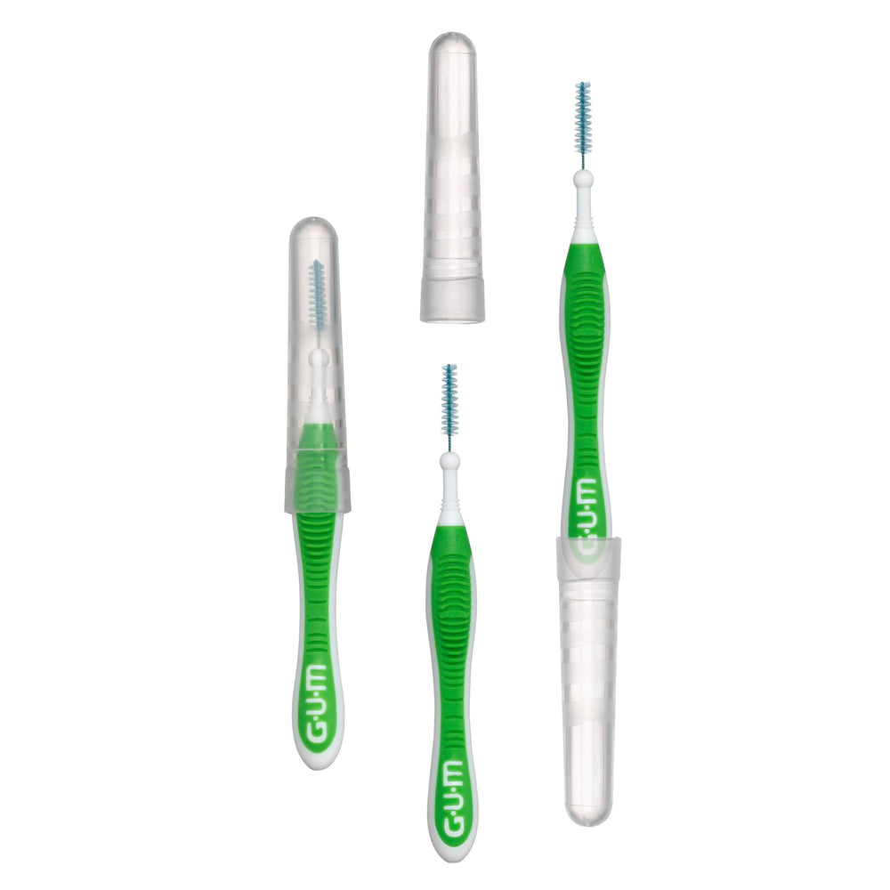 Comparación de tamaño GUM Proxabrush junto a un cepillo dentales para escala portátil