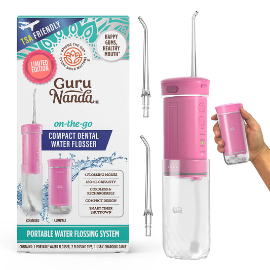 GuruNanda flosser frontal rosa mostrando diseño compacto y portabilidad