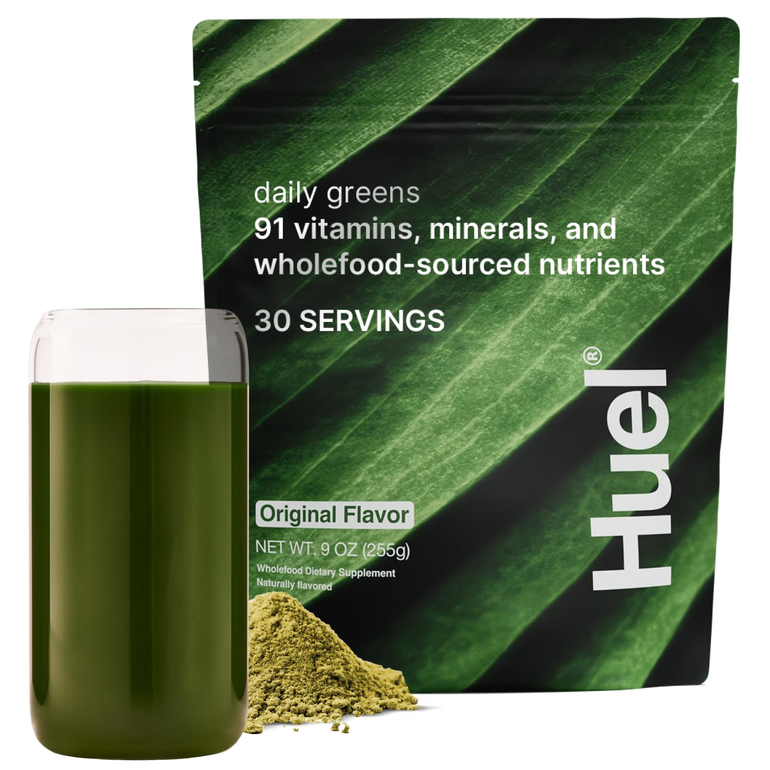 Huel Daily Greens envase frontal mostrando marca y beneficio nutricional