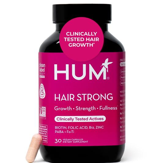 HUM Hair Strong frontal del envase mostrando el diseño y beneficios