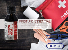 Humco Gentian Violet junto a regla para comparar tamaño y facilidad de transporte