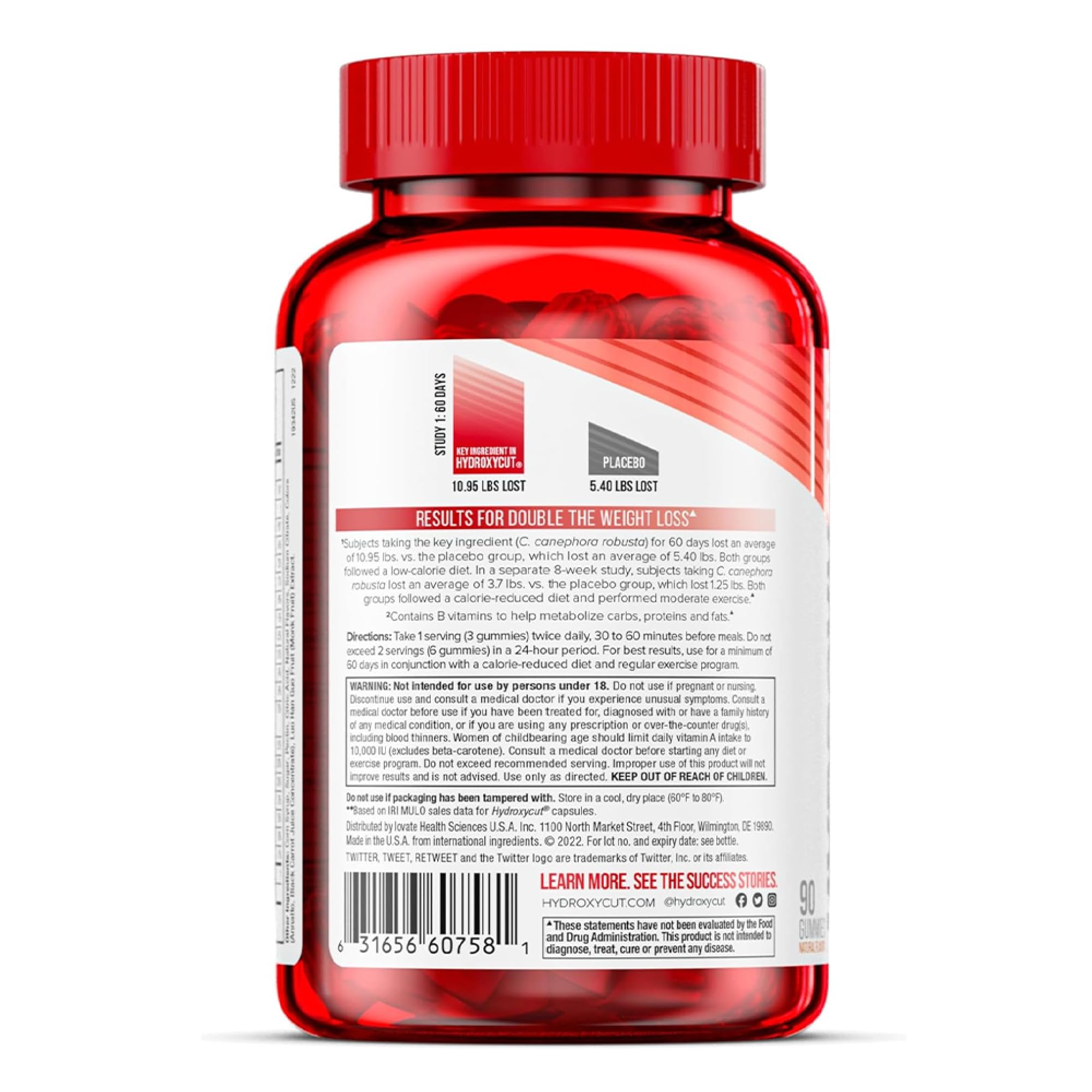 Hydroxycut en mesa junto a botella de agua y zapatillas, complemento de rutina activa