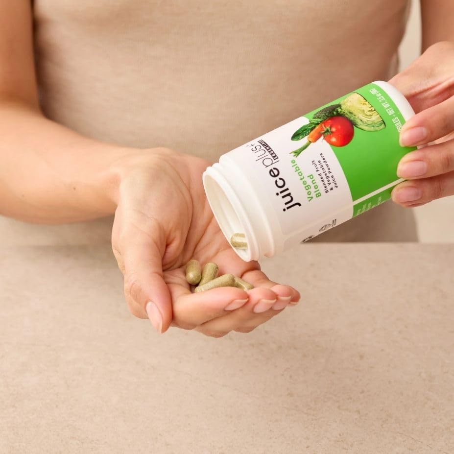 Juice Plus+ frascos junto a una regla para comparar tamaño práctico