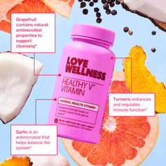 Love Wellness comparación de tamaño junto a moneda, referencia práctica