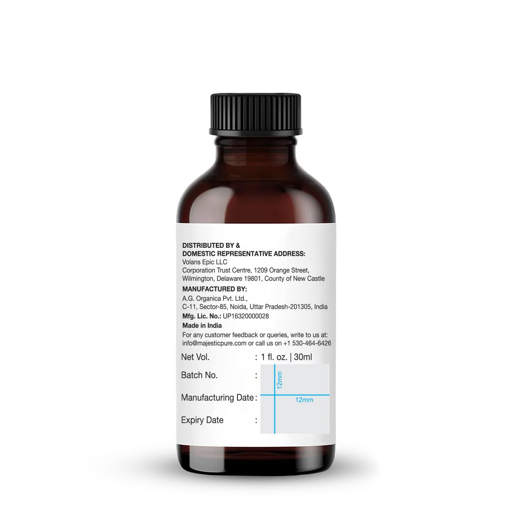 Majestic Pure frasco junto a moneda para comparar tamaño y capacidad