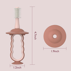 Momcozy bebé usando cepillo, fomenta hábitos de higiene suaves