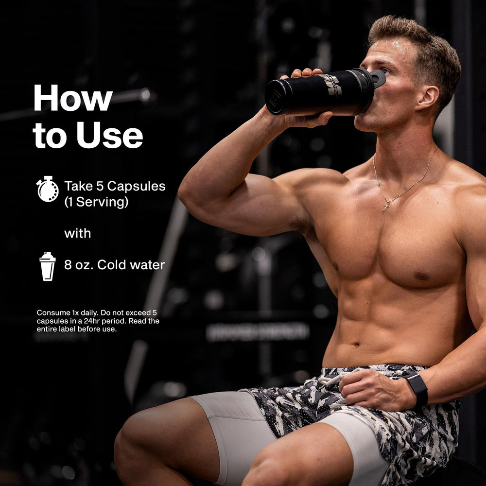 MuscleTech AlphaTest frasco sobre mesa con accesorios de entrenamiento