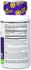 Natrol producto en mesita de noche junto a libros, sugiere apoyo al descanso nocturno