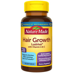 Nature Made frasco frente mostrando etiqueta y beneficio para cabello