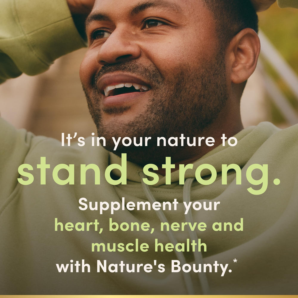 Nature's Bounty botella abierta con softgels listos para tomar