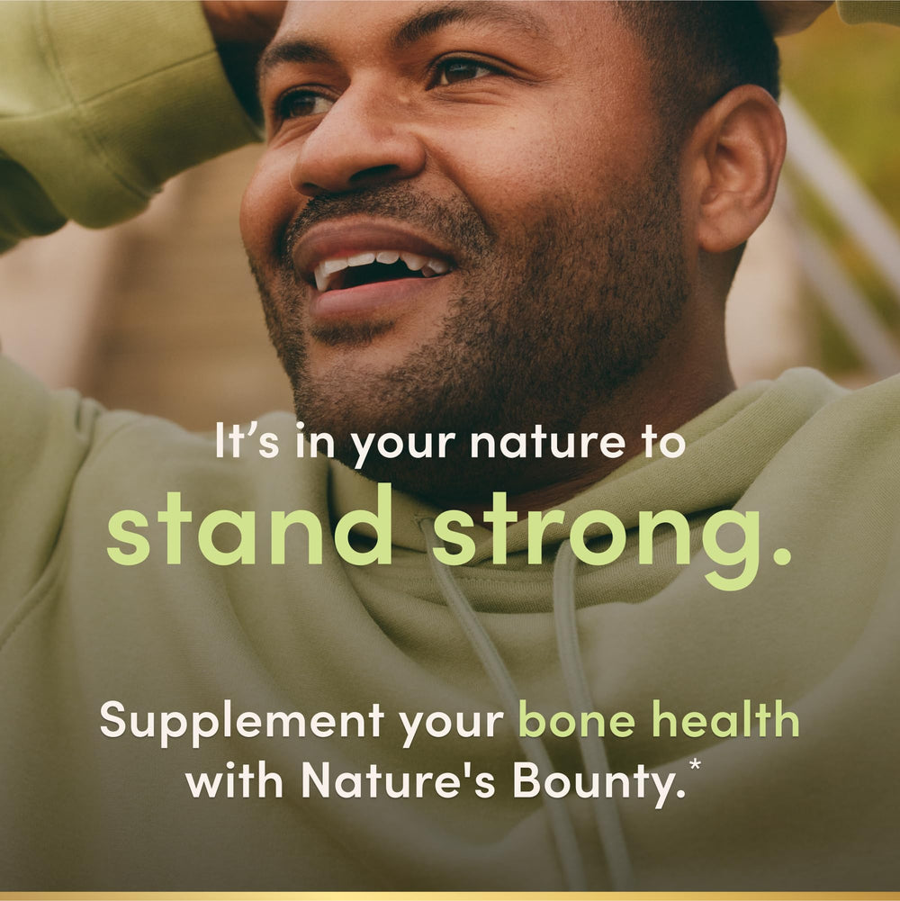 Nature's Bounty softgels junto a una regla para comparar tamaño y facilidad de tragar