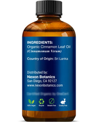 Escena lifestyle con vela y botella Nexon Botanics creando atmósfera cálida