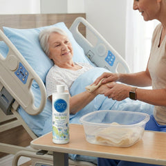 Envase No-Rinse junto a una regla para comparar tamaño y cantidad