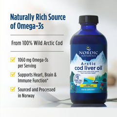 Botella abierta con cucharita dosificadora de Nordic Naturals para toma controlada