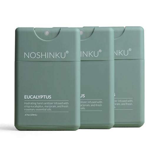 Noshinku paquete frontal mostrando tres sprays recargables y beneficio ecológico