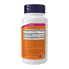 NOW Foods pack de PABA junto a una mano para comparar escala y facilitar dosis