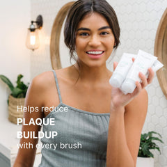 Nu Skin AP 24 tubo 4 oz junto a objeto para comparar tamaño