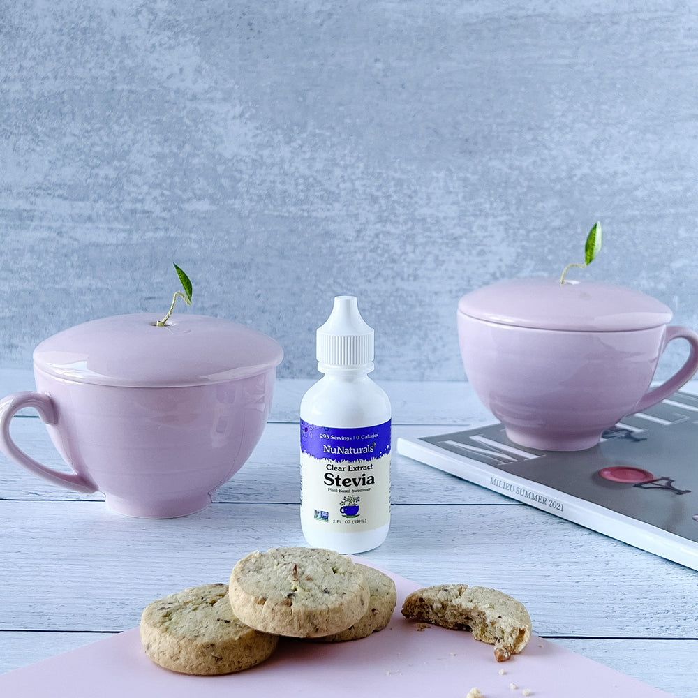 NuNaturals botella abierta con gotas visibles, beneficio control por porción