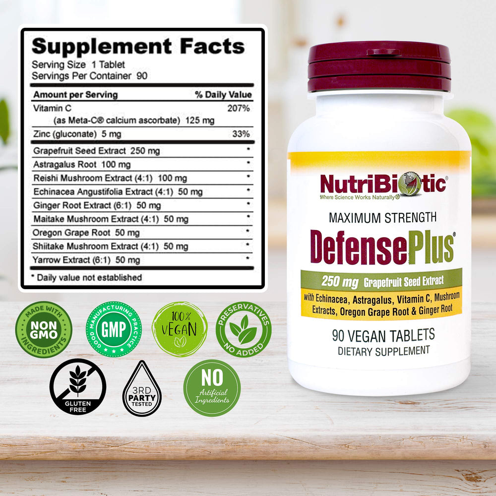NutriBiotic DefensePlus botella en mesa con bebida, uso práctico diario